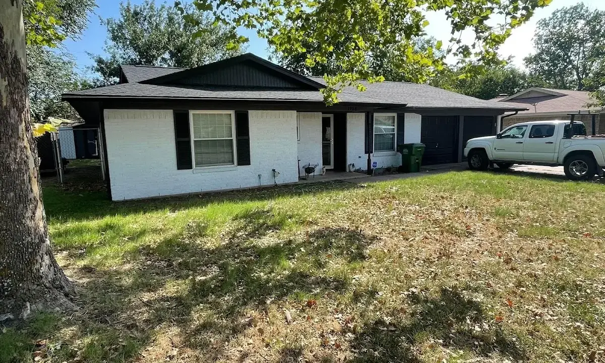 Professional roofing crew working on a residential roof in Northbrook